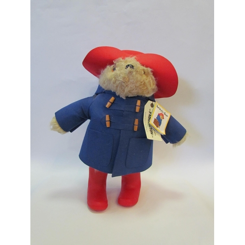 1251 - A Paddington bear, red hat and boots, blue duffle coat, 50cms tall     (R) £30