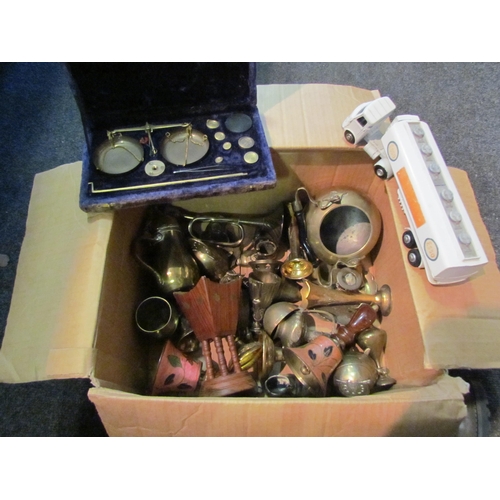 1256 - A box of brassware to include Persian coffee pot, bells, cased set of scales