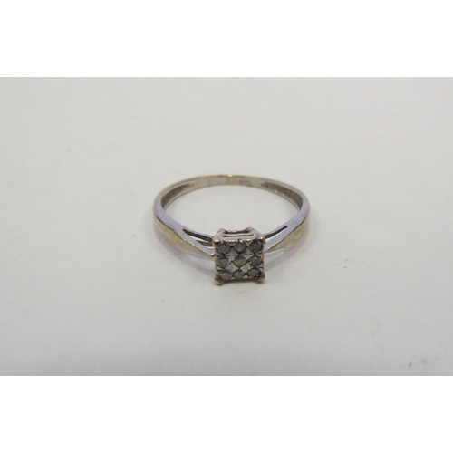 1320 - A 9ct white gold diamond set ring    (C)