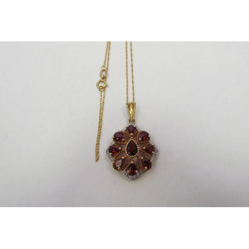 1323 - A 9ct garnet and diamond set pendant on 9ct chain, approximately 25mm, approximately 3g    (C)