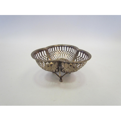 1324 - A pierced clover form silver bon bon dish on three legs, Birmingham 1912, approximately 45g