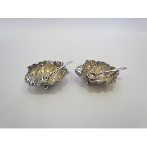 1334 - Two Joseph Gloster silver scallop form salts (different dates) with matched silver spoons, Birmingha... 