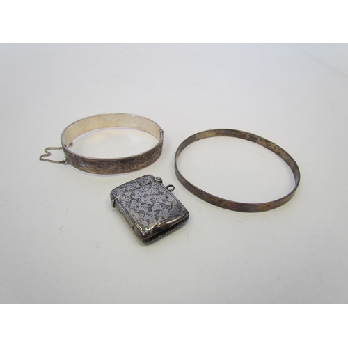 1347 - Two silver bangles and a silver vesta case