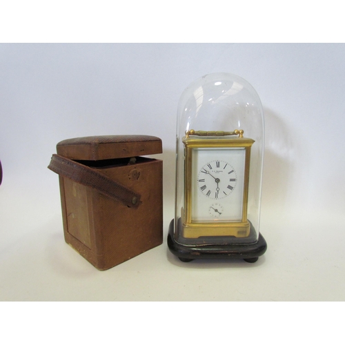 1375 - A cased brass carriage clock, named G.G. Denham, Leeds, with glass dome