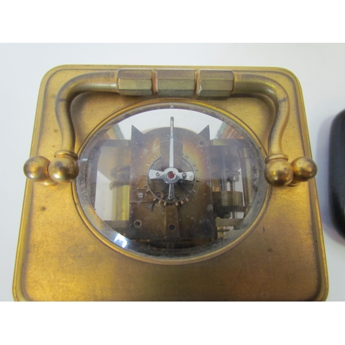 1375 - A cased brass carriage clock, named G.G. Denham, Leeds, with glass dome