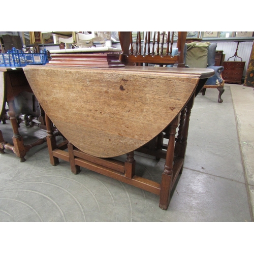 2162 - A large Georgian oak gateleg table