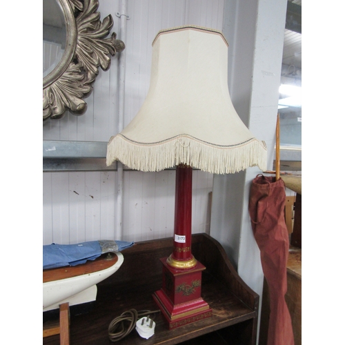 2173 - A red and gold table lamp