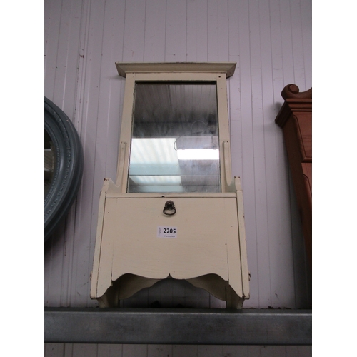 2205 - A 1950's painted wall mirror with drop down compartment