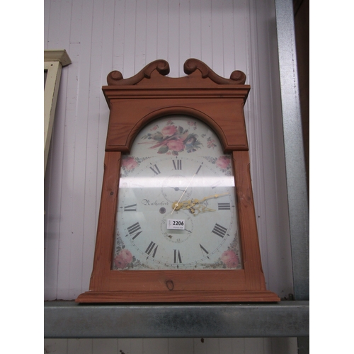 2206 - A pine cased wall clock