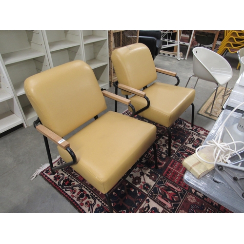 2257 - A  pair of tubular metal and cream upholstered chairs