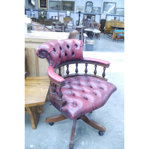 2009 - A red button leather captains desk chair