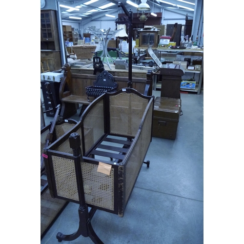 2012 - An early 20th Century mahogany swing cot with cane panels