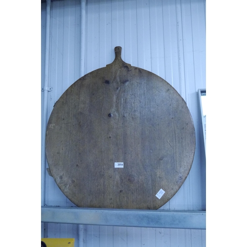 2056 - A 19th Century rustic pine cheese board 68cm diameter