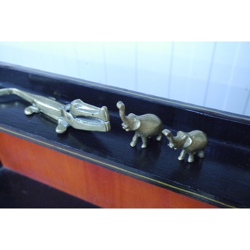 2059 - A brass crock nut cracker and two miniature elephants