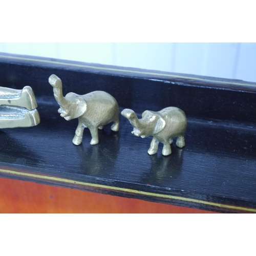 2059 - A brass crock nut cracker and two miniature elephants