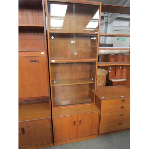 2248 - A retro G-plan teak glazed bookcase on two drawer cupboard base