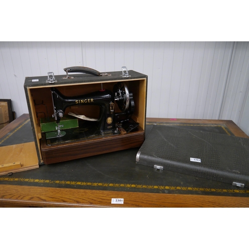 2302 - A cased Singer sewing machine