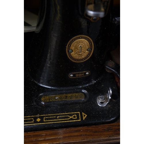 2302 - A cased Singer sewing machine