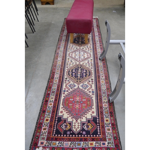 2311 - A late 20th Century persian runner rug, hand woven 288 x 80cm