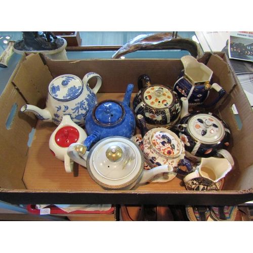 1476 - Seven teapots and two jugs including Imari, lustre, Japanese, Willow pattern etc. some a/f