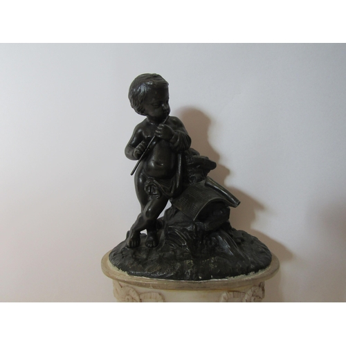 1513 - A bronze effect statue of a boy playing pipe on alabaster base, 32cm tall