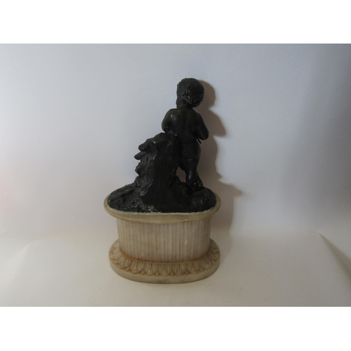 1513 - A bronze effect statue of a boy playing pipe on alabaster base, 32cm tall