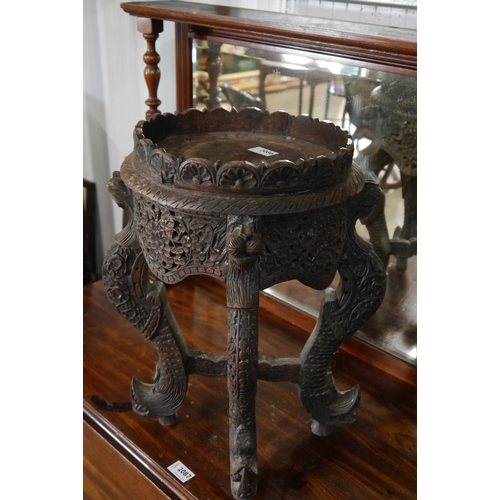 2086 - An Anglo Indian heavily carved hardwood jardinere stand