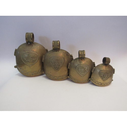 1001 - A graduated set of four brass cow bells, largest 24cm     (R) £25