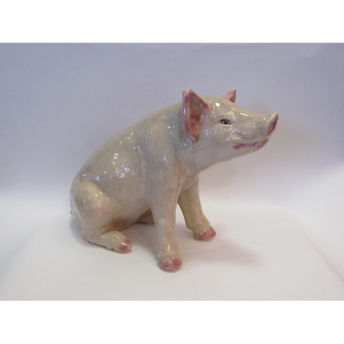 1002 - A 20th Century ceramic butcher's advertising pig, 32cm tall