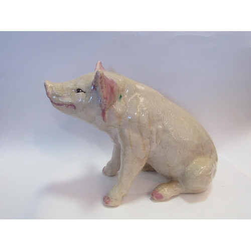 1002 - A 20th Century ceramic butcher's advertising pig, 32cm tall