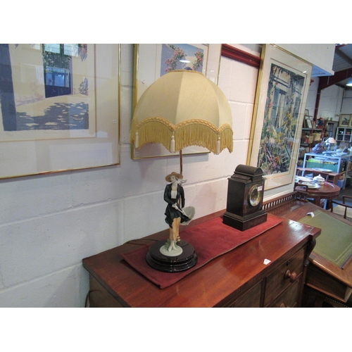 1030 - A Florence figural table lamp with tasselled shade