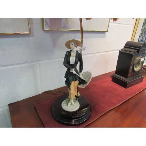 1030 - A Florence figural table lamp with tasselled shade