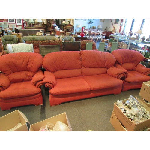 1180 - A G-Plan red upholstered three piece suite comprising of a large two seater sofa and two armchairs  ... 