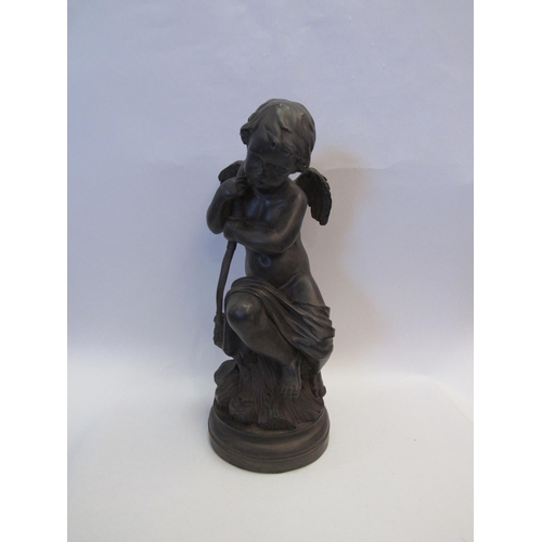 1223 - A bronze effect resin cherubic sculpture, 46cm tall