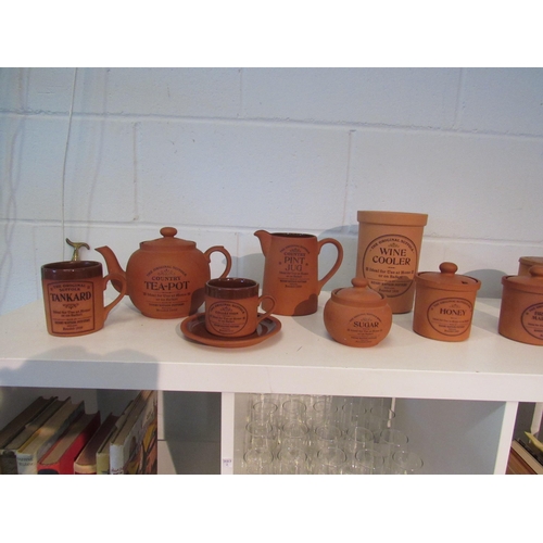 1388 - A large quantity of Henry Watson Pottery including coffee and sugar storage jars, teapot, cup and sa... 