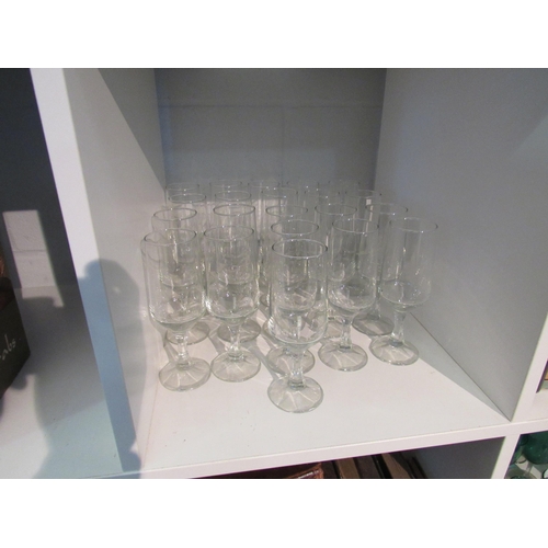 1390 - Twenty one champagne flutes with facet stems