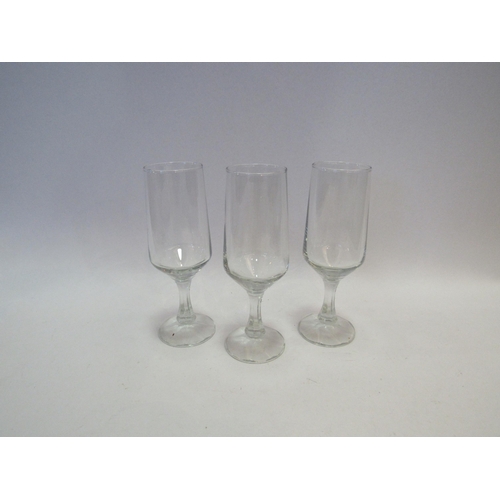 1390 - Twenty one champagne flutes with facet stems