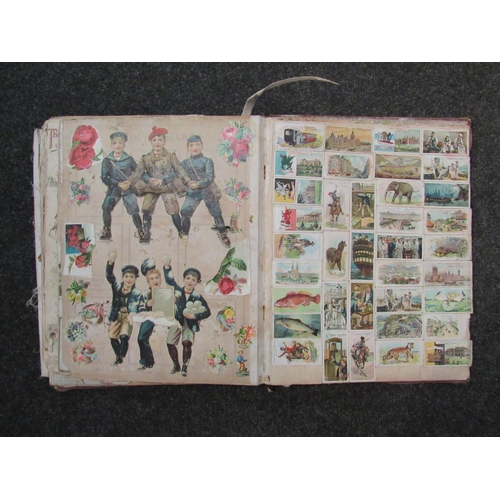 1416 - A late 19th Century scrap album containing scraps of animals, flowers, advertising etc, folio contem... 