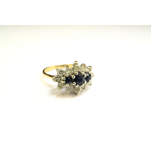 9287 - An 18ct white gold sapphire and diamond cluster ring. Size K, 4.1g