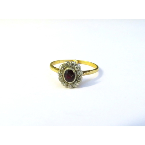 9175 - An unmarked gold ruby and diamond cluster, inside inscribed 