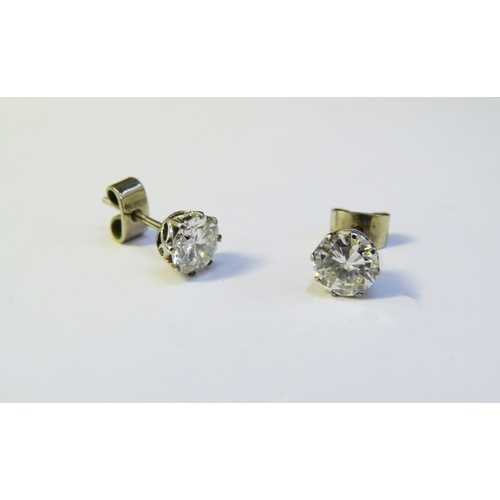 9138 - A pair of diamond stud earrings, 1.50-2ct total approx, 6mm diameter x 4mm deep