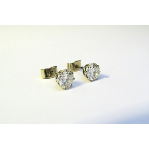 9138 - A pair of diamond stud earrings, 1.50-2ct total approx, 6mm diameter x 4mm deep