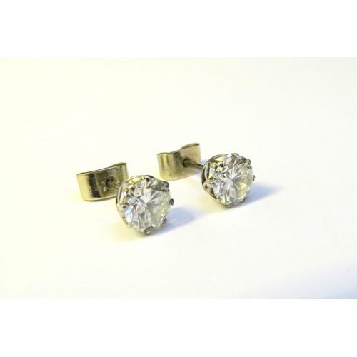 9138 - A pair of diamond stud earrings, 1.50-2ct total approx, 6mm diameter x 4mm deep