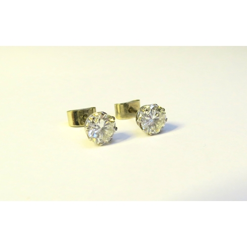 9138 - A pair of diamond stud earrings, 1.50-2ct total approx, 6mm diameter x 4mm deep