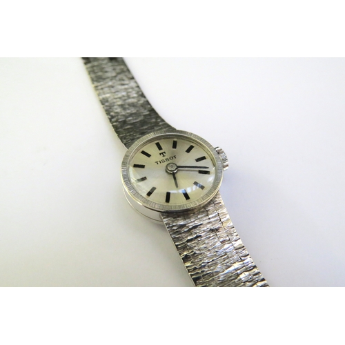 9142 - A 9ct white gold Tissot wristwatch, bracelet as found