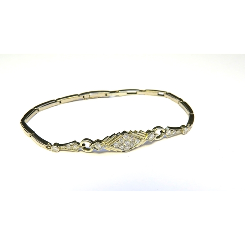 9135 - An unmarked platinum Art Deco style bracelet with sprung links, the centre lozenge set with nine dia... 