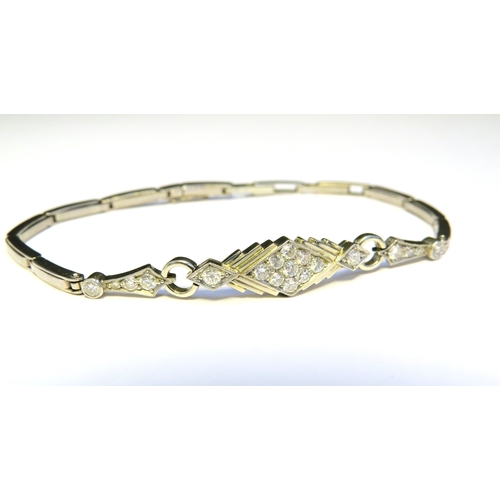 9135 - An unmarked platinum Art Deco style bracelet with sprung links, the centre lozenge set with nine dia... 