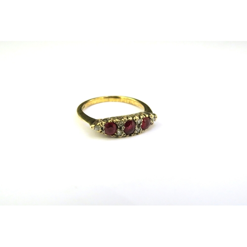 9293 - A gold ruby and diamond ring, shank stamped 18ct. Size L/M, 2.8g