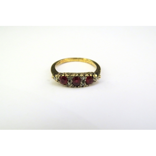 9293 - A gold ruby and diamond ring, shank stamped 18ct. Size L/M, 2.8g