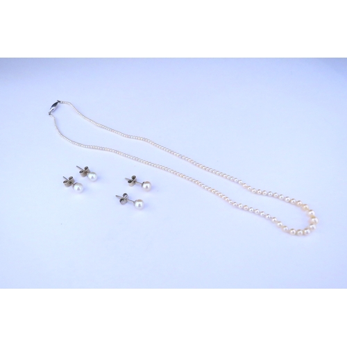 9318 - A single strand fine pearl necklace and two pairs of pearl stud earrings